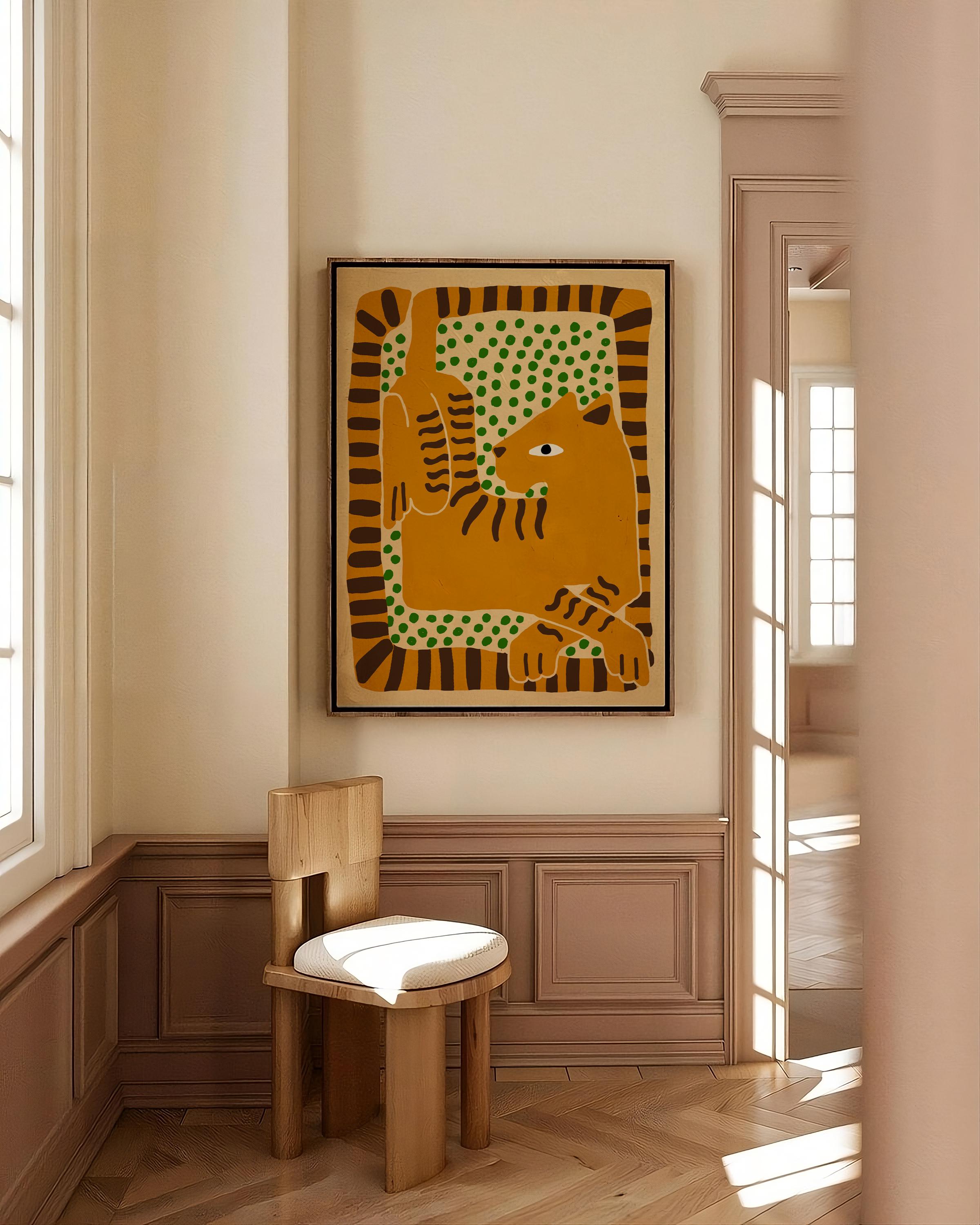 Decorative wall art with a cat design in a room with wooden chair and window.